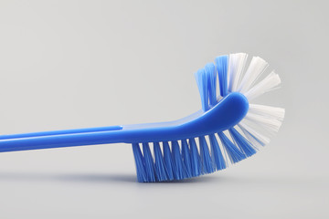 Toilet brush isolated on gray background