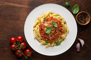 penne pasta with Bolognese sause in white plate