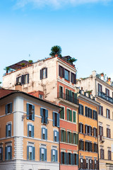 Fototapeta na wymiar Old cobblestone narrow street and buildings in Rome, Italy