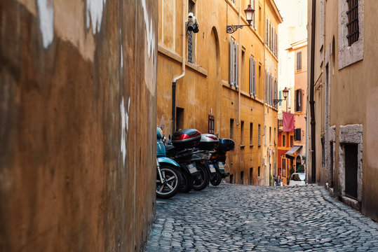 Old cobblestone narrow street in Rome, Italy
