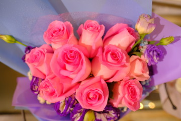 Macro view of colorful blue red green white pink purple rose flower bouquet in full blossom
