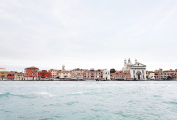 Fototapeta na wymiar View of the embankment of Venice from the Venetian lagoon
