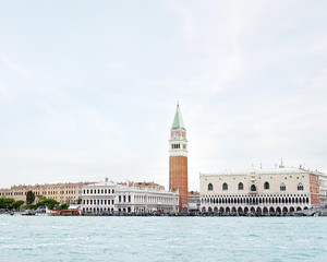 Fototapeta na wymiar View of the Venice embankment and the Campanile of St. Mark Cathedral and the Doges Palace from the side of the Venetian lagoon