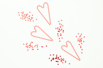 New year concept. Christmas composition with candy canes on white background. Flat lay