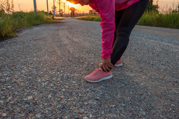 The evening sunset, The area of the wind turbine generates clean energy electricity, A woman is...