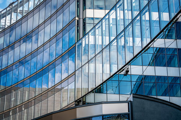 Fototapeta na wymiar Modern office building with reflection in windows