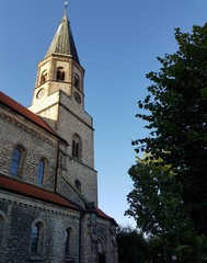 Fototapeta na wymiar church architecture, tower, religion, building, old, sky, europe, cathedral, blue, city, cross, landmark, catholic, religious, germany, town, monument, gothic, stone, historical, steeple