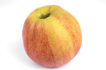 Side view on isolated splattered with water ripe autumn apple on white background