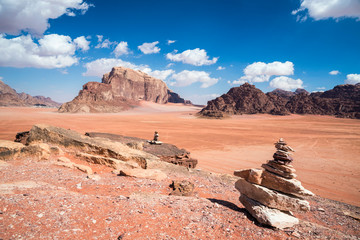 Fototapeta na wymiar Millenary stone piles at Wadi Rum desert, southern Jordan