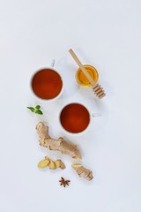 Ingredients for herbal ginger tea with honey, star anise and anise. Healthy food detox concept. Flat lay with space for text. Top view.