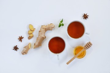 Ingredients for herbal ginger tea with honey, star anise and anise. Healthy food detox concept. Flat lay with space for text. Top view.