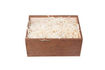 Open wooden box with filling material inside. Empty natural wooden box with decorative straw for...