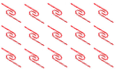 Christmas candy cane pattern on white background. Flat lay and top view