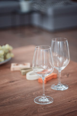 Two wine glasses on the wood table