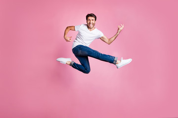 Full body photo of cheerful funny funky middle eastern man heavy metal lover jump have fun spring...