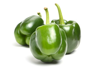 fresh green bell pepper (capsicum) on a white background
