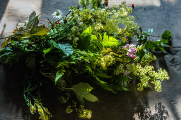 Bunch of flowers on old table.