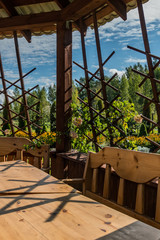 Arbor with table and chairs.