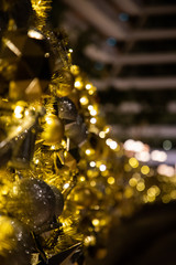 Close up of Christmas golden decoration with sparkles and lighjts