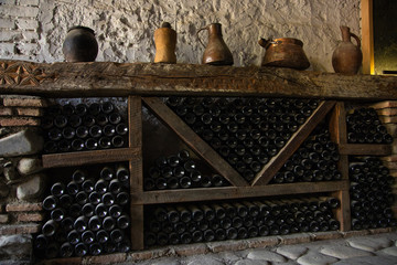 Fototapeta na wymiar Wine cellar, old dusty bottles of wine