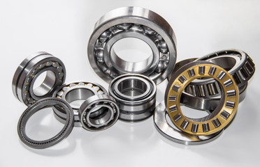 A set of various ball bearings and roller bearings isolated on gray
