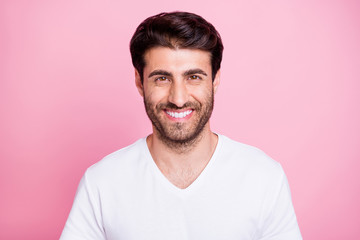 Obraz premium Portrait of positive cheerful imposing middle eastern man look listen have weekends in spring wear white outfit isolated over pink color background