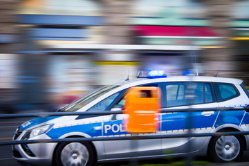Fototapeta na wymiar German police car fast drive in action