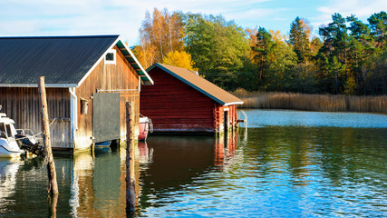 Boatsheds at Turku archipelago, Finland on a beautiful autumn day.