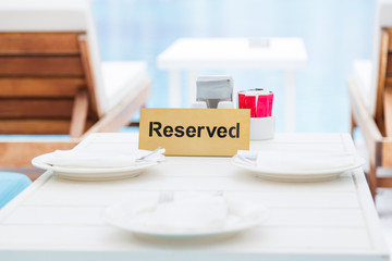 Reserved table in the lounge area by the pool.