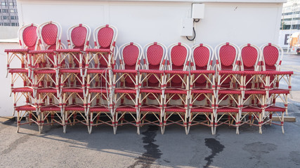Chairs stacked up outside a cafe in Turku, Finland ready to be arranged and set up for the lunchtime.