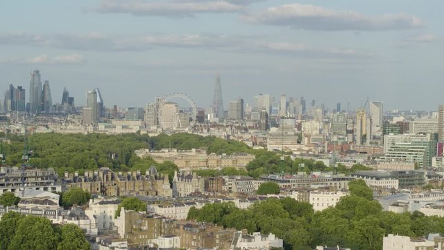 Aerial establishing shot of central london featuring Buckingham palace