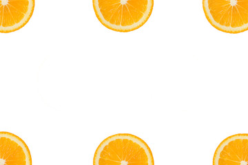 Colorful fruit pattern of fresh orange or lemon slices in the corners on white isolated background. Top view. Copy space.