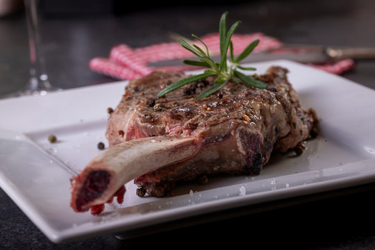 beautifully seared tomahawk steak, medium rare to rare