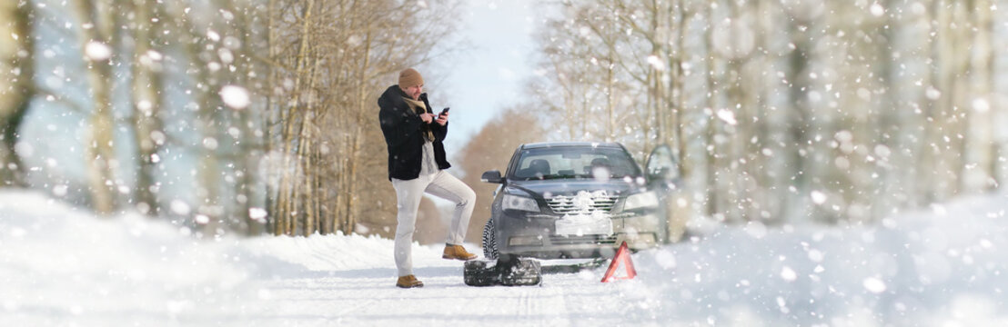 A Man Near A Broken Car On A Winter Day