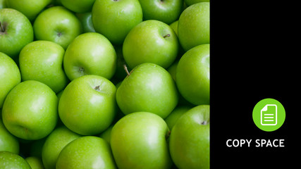 Green apple. Apple background. Copy space. Black background. Apple black.
