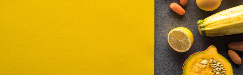 top view of fruits and vegetables on yellow and grey background, panoramic shot