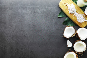 Coconut on a dark stone table. Coconut oil.