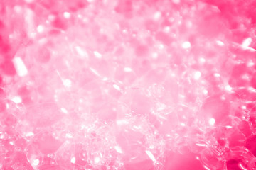 Beautiful abstract texture color white and pink bubbles background in water on pink background pattern clear soapy shiny
