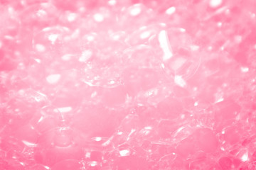 Beautiful abstract texture color white and pink bubbles background in water on pink background pattern clear soapy shiny