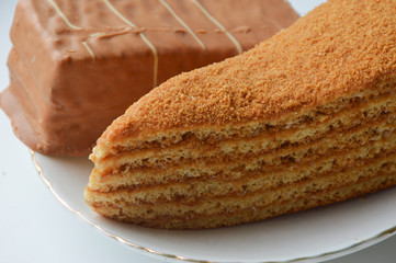 two delicious cakes on a white plate. candy.