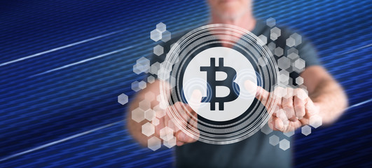 Man touching a bitcoin concept