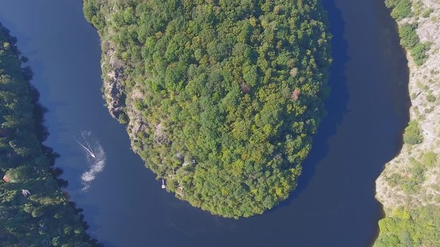 Aerial view of Vltava river horseshoe meander with green forest near Maj view point next to Prague in central Bohemia, Czech republic