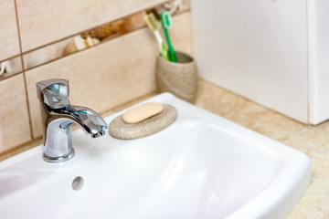 faucet hygiene in the bathroom background