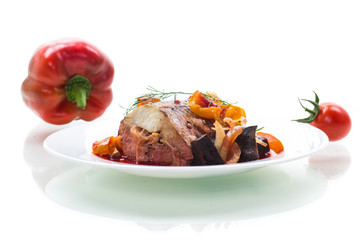 fish stew with beets and other vegetables in a plate