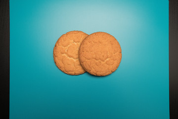 Cookies studio image. Homemade tasty cookies on a blue background.