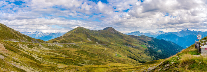 Fototapeta na wymiar Panoramic view from Pennes Pass to the valley in South Tyrol - Italy