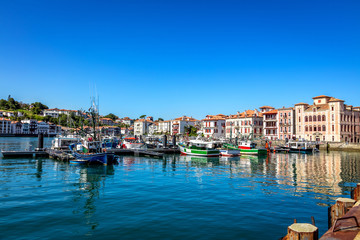 Saint-Jean-de-Luz, France - View of the harbor and the village dwellings - obrazy, fototapety, plakaty