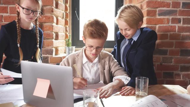 Cute children working together as a team. Partnership concept