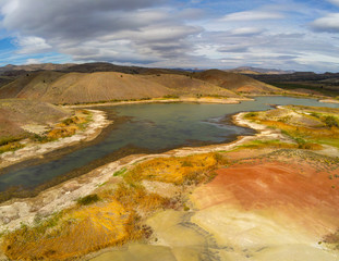 Audacious aerial Photography of the vibrant and  photogenic John Day Fossil Beds and the iridescent Painted Hills Reservoir of Wheeler County in Mitchell, Oregon