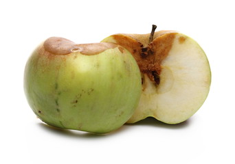 Rotten apple sliced in half isolated on white background